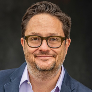 Headshot of Aaron Hurst