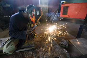 A Wonder Welder's employee puts the finishing touches on a metal pig.