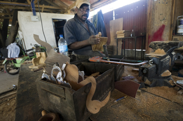 Ciprian Bwile makes toys, animals, and bookends from scrap wood. (All photos by Jonathan Kalan)