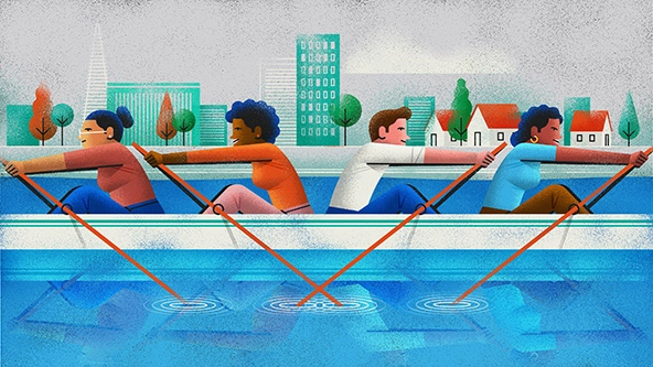 Four people in a boat. Two are rowing in one direction, two are rowing in the other.