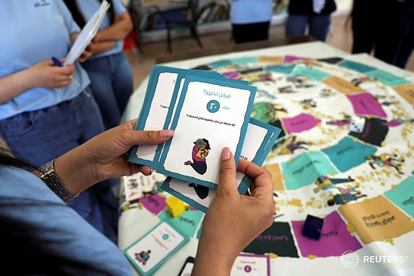 hands holding school flashcards