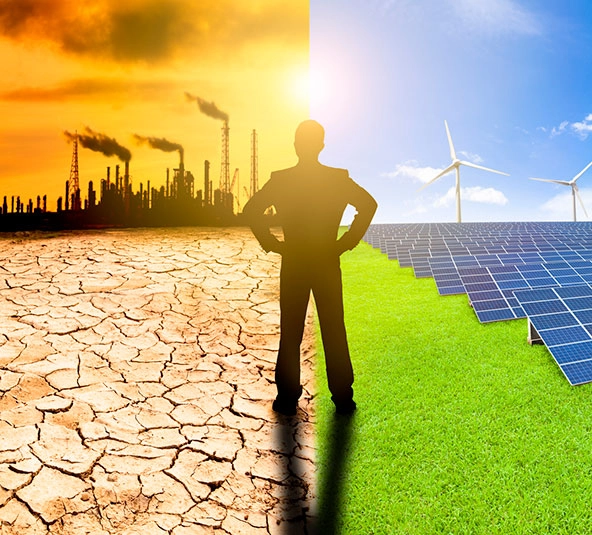 Businessman watching windmills, solar panels, and refinery with air pollution