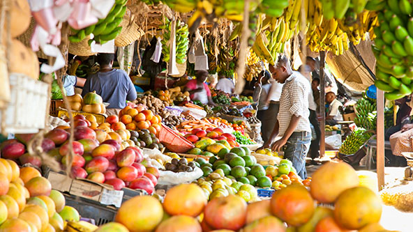 Ripe fruits stacked at a local fruit and vegetable market in Nairobi, Kenya.