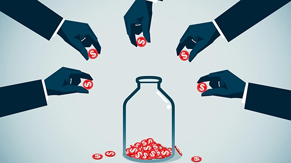 Hands putting coins into a jar
