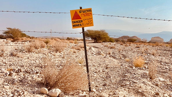 Land mine in desert landscape in the Middle East