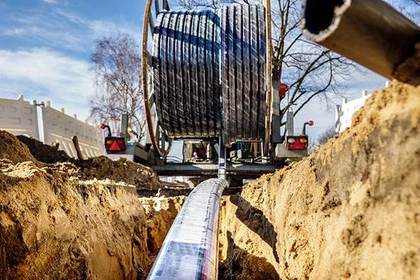 Fiberglass cable being put into the ground