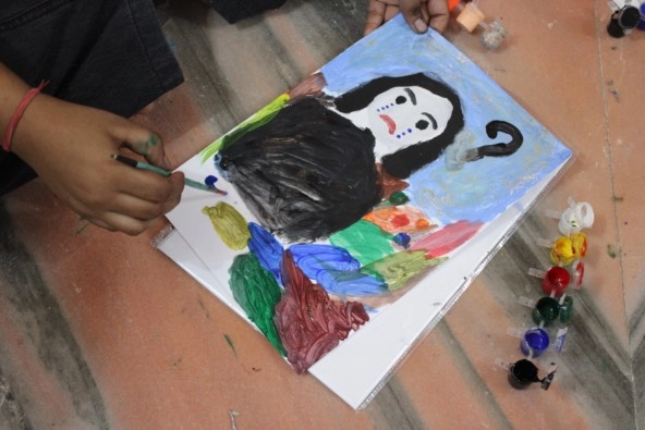 self-portrait painting by a girl in India for nonprofit program