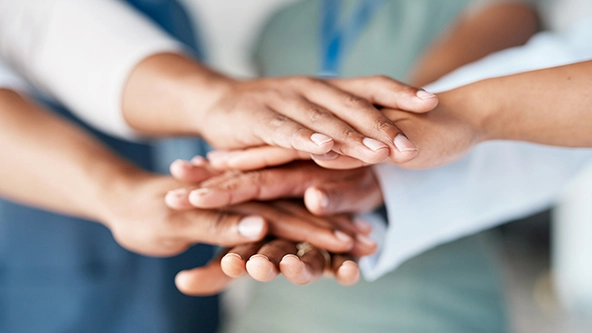 hands stacked together