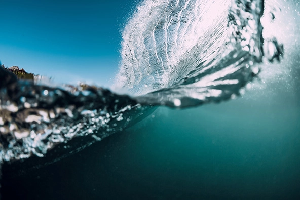ocean wave crashing on beach