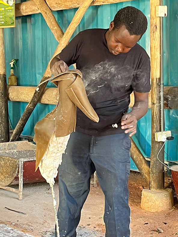 Man making an animal sculpture