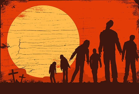 Silhouette of zombies walking at graveyard