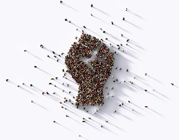 human crowd forming a fist symbol