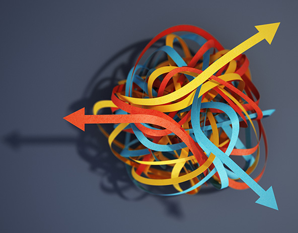 Tangled paper strips blue, yellow and red with arrows pointing different ways