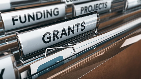view of brown folders, with focus on grants label