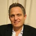 SSIR blogger David Simpson is the co-founder and president of GoldMail and is on the board of Aim High.