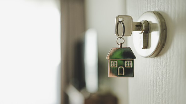 door handle with a key and a keychain shaped house