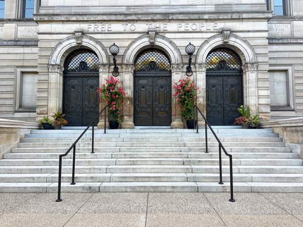 stairs leading to three doors at the Carnegie Library of Pittsburgh entrance