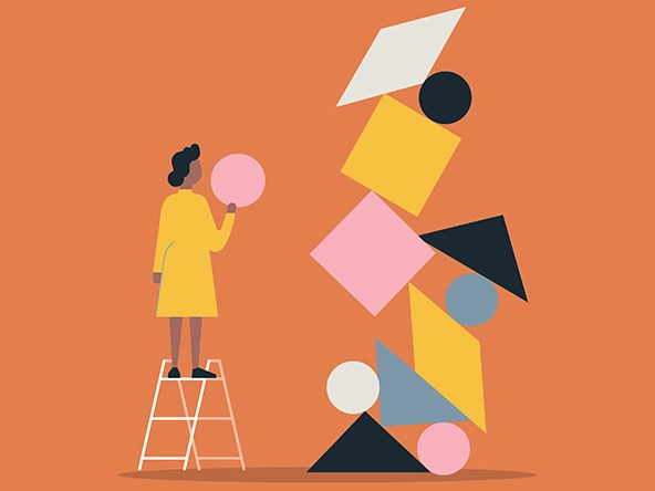 Illustration of person building with balanced shape blocks