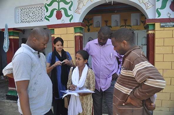 People from West Africa and India in discussion with one another